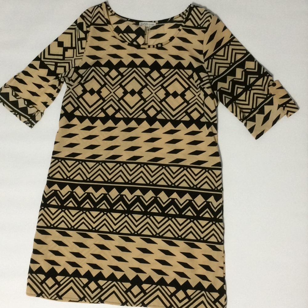 Tan and black dress with cuffed sleeves.